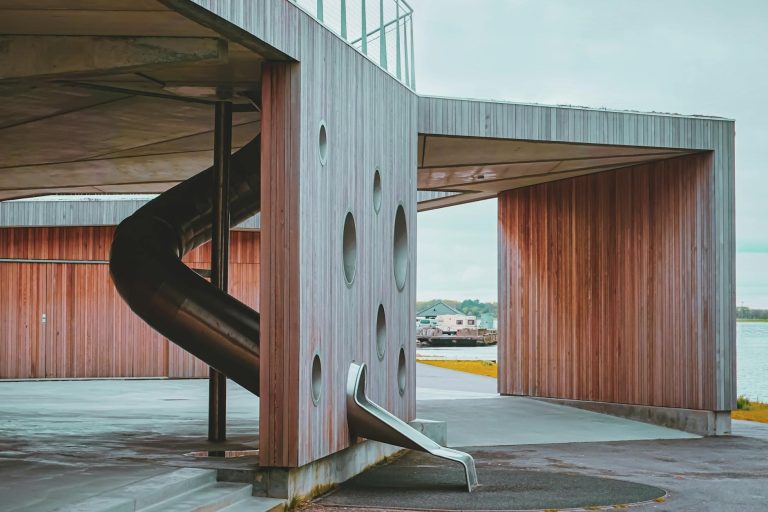 What distinguishes metal slides for playgrounds?